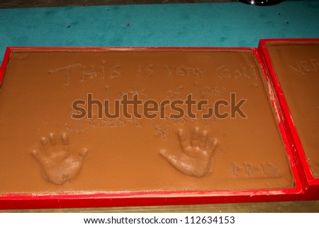LOS ANGELES - SEP 11:  Simon Cowell Handprints at the FOX  X-Factor Judges Handprint Ceremony at Graumans Chinese Theater on September 11, 2012 in Los Angeles, CA