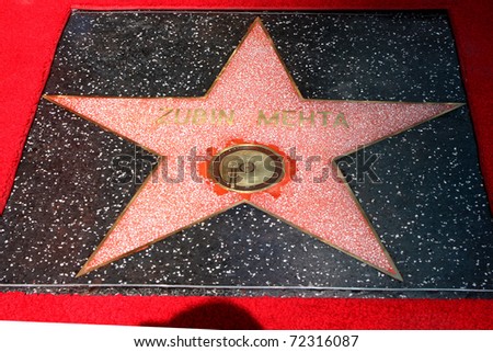LOS ANGELES -  MARCH 1:  Maestro Zubin Mehta\'s Hollywood Walk of Fame star is installed with an error on March 1, 2011 in Los Angeles, CA. The artist symbol is installed backwards and needs to be repaired. His star is on Vine Street, south of Hollywood Bl
