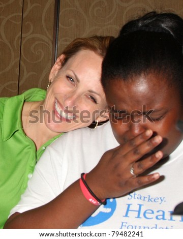 LAS VEGAS - JUN 18:  Marlee Matlin, child react to being able to hear at the Starkey Foundation Event  for Children\'s Miracle Nework & Daytime Emmys at Hilton Hotel on June 18, 2010 in Las Vegas, NV