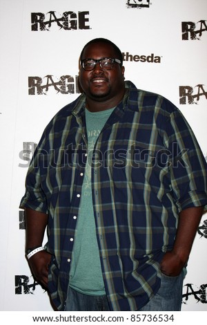 LOS ANGELES - SEPT 30:  Quinton Aaron arriving at  the RAGE Game Launch at the Chinatown\'s Historical Central Plaza on September 30, 2011 in Los Angeles, CA
