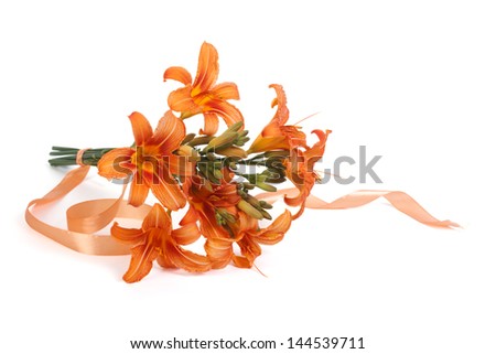 Bouquet of orange lilies tied with ribbon isolated on white background
