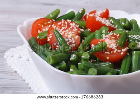 fresh salad of green beans with sesame seeds and tomatoes