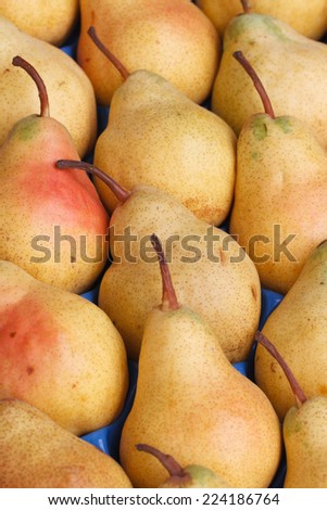 tasty ripe yellow pear close-up. background vertical