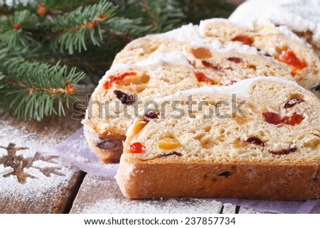 Christmas fruit bread Stollen close-up on the table. horizontal, rustic style