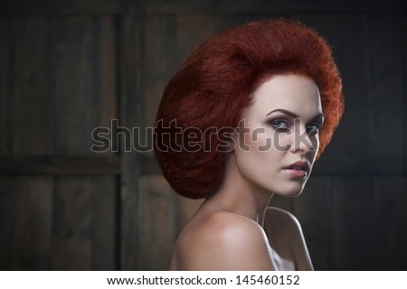 red haired girl with huge haircut