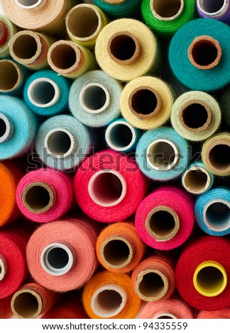colored bobbins background. red, orange, blue and yellow colors