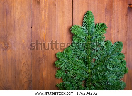 Fir branches in the form of Christmas trees on wooden boards