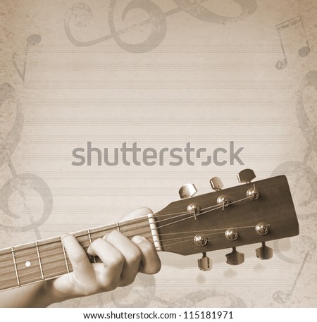 musical background with hand holding a guitar and musical notes