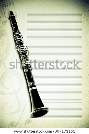musical background with flute, key and notes. toned photo