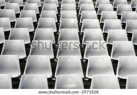 Many Empty Seats In Rows In An Outdoor Stadium