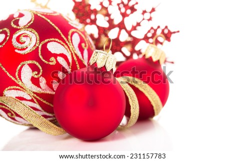 Golden and red christmas ornaments on white background. Merry christmas card. Winter holidays. Xmas theme.
