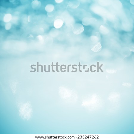 Unfocused abstract turquoise glitter holiday background