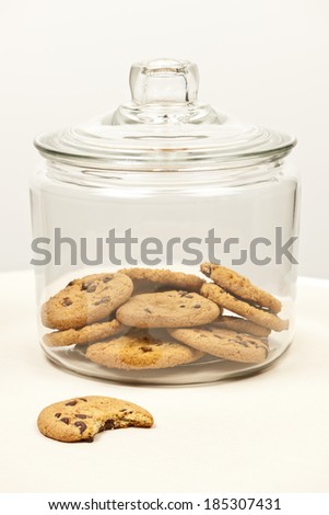 Glass cookie jar with chocolate chip cookies