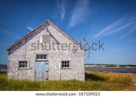 Old building on Atlantic shore in North Rustico, Prince Edward Island, Canada.
