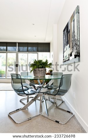 Dining table and chairs in loft apartment - artwork from photographer portfolio