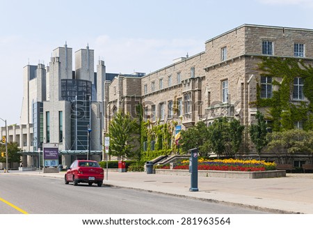 KINGSTON, CANADA - AUGUST 2, 2014: Union Street with modern Stauffer library and historic Students Memorial Union buildings on Queen\'s university campus in Kingston, Ontario, Canada.