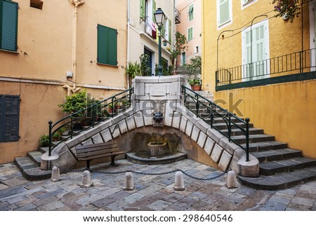 Small square with fountain Place du Conseil used to be the center of local government in medieval town Villefranche-sur-Mer on French Riviera, France.