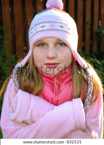 Young Girl Shivering In Cold Weather, Wearing Winter Hat Stock Photo ...