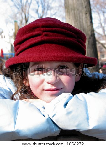 Portrait of a girl in a red hat