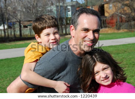 Father with children playing outside