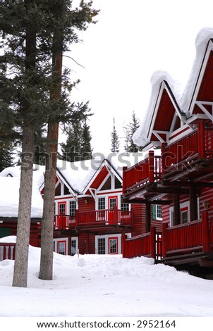 Log buildings of a mountain lodge in winter at ski resort