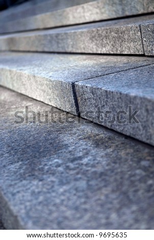 Stairway with granite stone steps in perspective close up