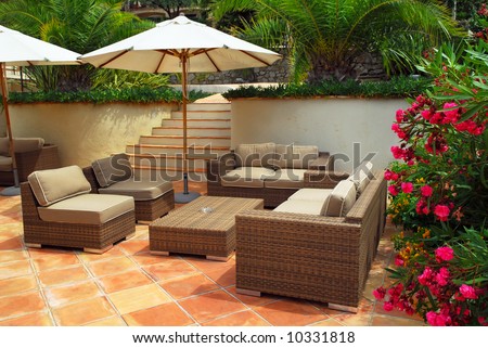 Patio of mediterranean villa in French Riviera with wicker furniture