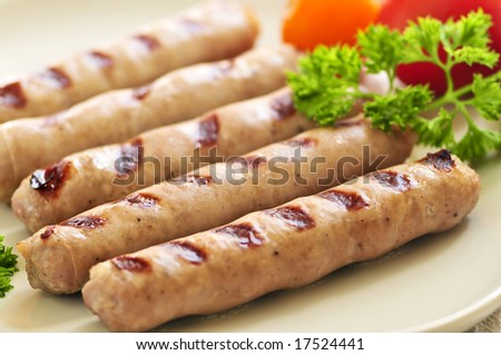 Serving of grilled breakfast sausages on a plate