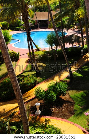 Swimming pool and garden landscaping at tropical resort