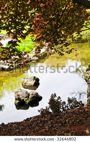 Pond with natural stones in japanese zen garden