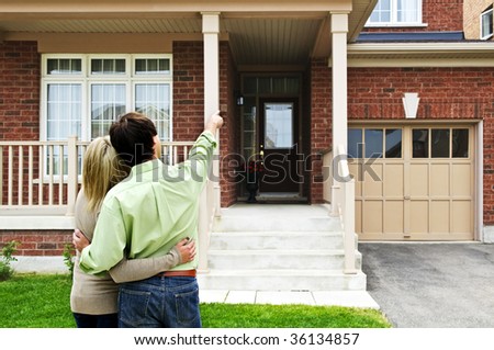 Young happy couple shopping for new home