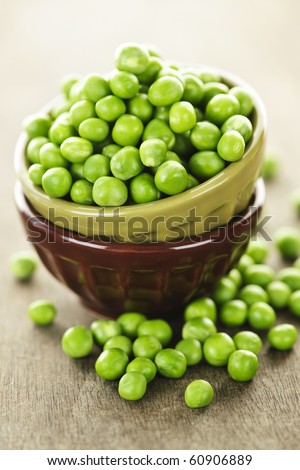 Bowl full of fresh green organic green peas