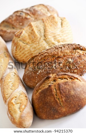 Assorted kinds of fresh baked bread in a row
