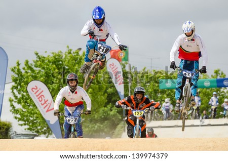 ESTARREJA, PORTUGAL - MAY 26: Fabio Ferreira jumping with style at the 2nd Portugal Bmx Open on may 26, 2013 in Estarreja, Portugal.
