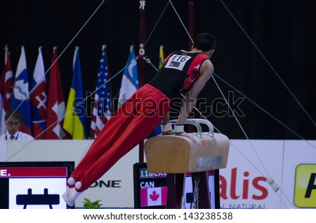ANADIA, PORTUGAL - JUNE 21: Evan Cruz (CAN) during the Art Gymnastics FIG World Cup Challenge on june 21, 2013 in Anadia, Portugal.