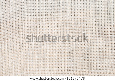Closeup detail of beige canvas texture background.