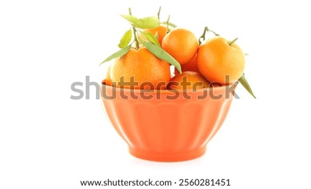 Similar – Foto Bild Orangefarbene Mandarinen in Keramik-Ornamentschale auf Holztisch