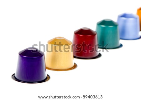 Coffee capsules for a coffee machine, close up view isolated on white background.