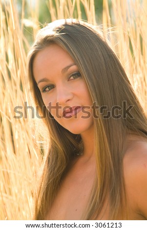 naturally beautiful model in tall grass, headshot