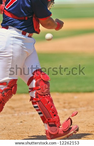 baseball catcher tossing the ball to mound when inning ends with strike three