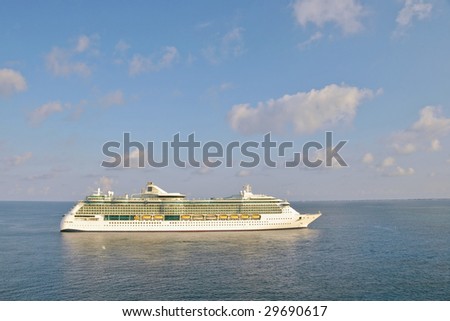 luxury cruise liner arriving early morning into caribbean port