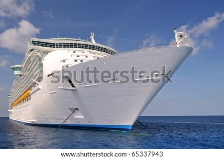 huge modern luxury cruise ship anchored off shore in ocean port