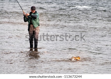 Fishing on river Shishged in the Mongolia - the lenok fish on hook