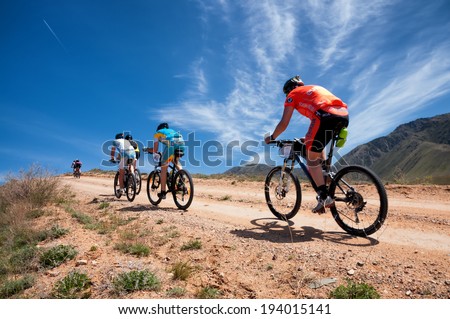 ALMATY, KAZAKSTAN - MAY 01, 2014: Unidentified bikers in action at Adventure mountain bike cross-country marathon in mountains \