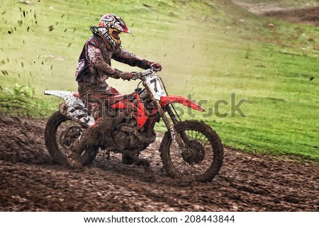 ALMATY, KAZAKHSTAN - APRIL 14 I.Belobrodov (N77) and other at the Motocross competition \