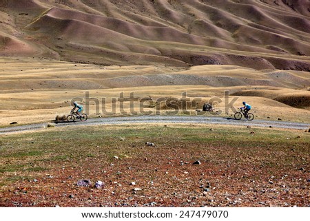 ALMATY, KAZAKHSTAN - SEP 13, 2009: Unknown bikers in action at Adventure mountain bike cross-country competition in mountains \