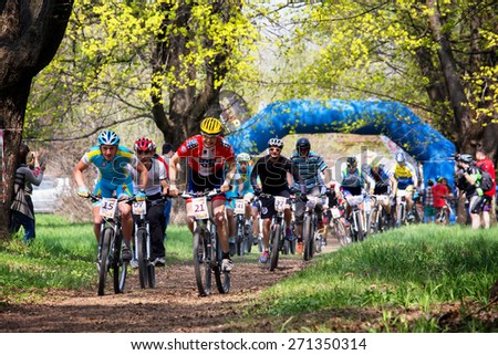 ALMATY, KAZAKHSTAN - APRIL 19, 2015: Group of bikers started in action at cross-country competition \