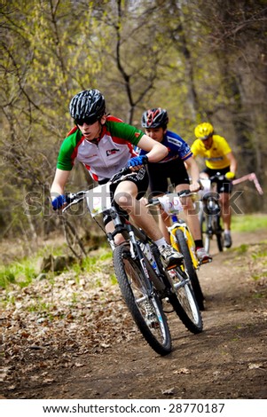ALMATY, KAZAKHSTAN - APRIL 5: Ivan Korolev (No. 53) leads a pack of cyclists at cross-country relay race April 5, 2009 in Almaty, Kazakhstan.
