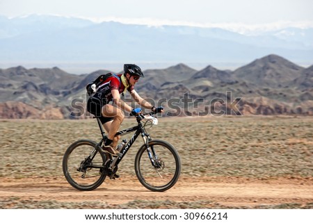 ALMATY, KAZAKHSTAN - MAY 1: Vladimar Philipchuk (N22) in action at Adventure mountain bike cross-country marathon in desert 