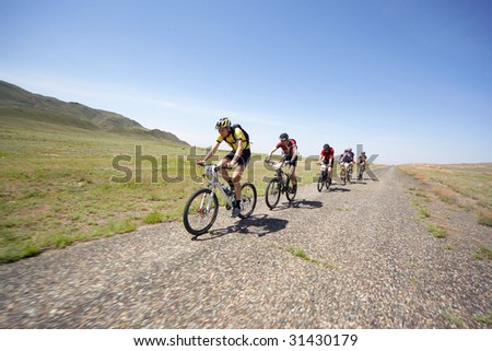 ALMATY, KAZAKHSTAN - MAY 1: Dmitry Rakhimkulov (N21) in action at Adventure mountain bike cross-country marathon in desert \